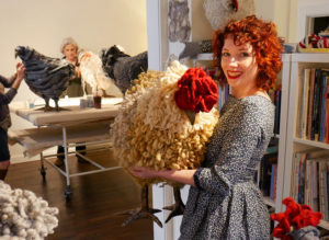 Betsy holds the chicken named after her