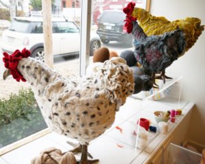 Three chicken footstools adorn the studio window