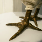 The bronze foot of a chicken footstool