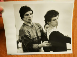 A photo shows Rudolf Nureyev instructing a young Devon Carney.