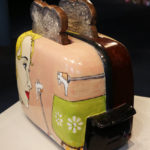 Side view of ceramic toaster and toast made by Shalene Valenzuela