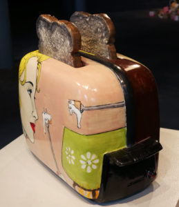 Side view of ceramic toaster and toast made by Shalene Valenzuela