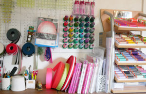 Notions, thread and a pile of books in Tula Pink's studio.