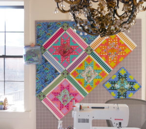 Tula Pink's Bernina sewing machine and quilt design wall.