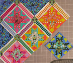 Tula Pink's design wall with a quilt in-progress using her Tula Pink All Stars fabric collection.