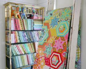 A quilt that features Tula Pink's Tabby Road fabric collection.