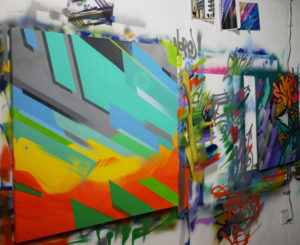 A cavalcade of painting adorns the walls in Phil Shafer's studio.