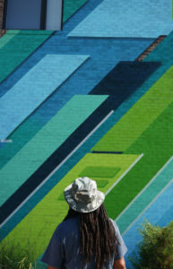 Phil Shafer contemplates his mural in downtown Kansas City.