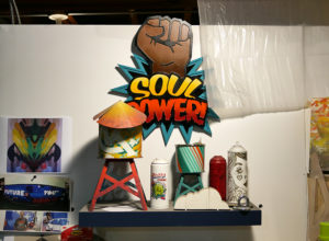 Repurposed spray paint cans become works of art in Phil Shafer's studio.