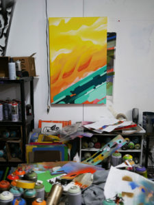 A piece of Phil Shafer's art hangs on the wall of his studio.
