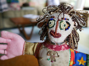Detail of the beaded face of one of Nedra's handmade dolls.