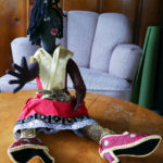 One of Nedra's dolls, featuring a sparkley skirt and embroidered shoes.