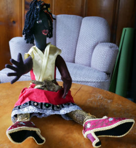 One of Nedra's dolls, featuring a sparkley skirt and embroidered shoes.