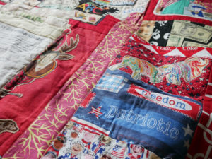 A detail of Nedra's quilt, Brownbackistan, detailing life in Kansas during Sam Brownback's term as governor.