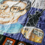 Detail of Nedra's Rosa Parks quilt, shows parks, the Statue of Liberty and a bus.