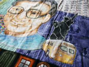 Detail of Nedra's Rosa Parks quilt, shows parks, the Statue of Liberty and a bus.