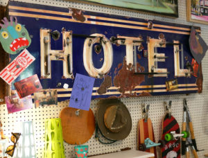 A vintage neon sign hangs in artist Seth Smith's studio.