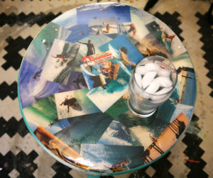 A table decorated with vintage surfing images.