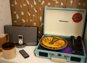 Seth's record player sits next to his iPod on his studio bookcase.