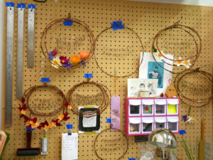Undecorated wreaths hang in Grace D. Chin's studio.
