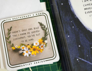 Grace D. Chin's artwork featured on coasters for a local restaurant.