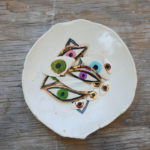 A bowl of ceramic evil eyes from Sweet Destructor.
