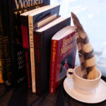 Books stacked on the window ledge in Jillian's studio.