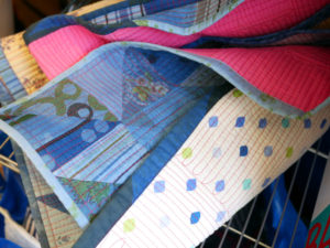 Glimpses of patchwork and stitching on one of Luke's quilts.