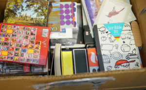 A boxful of stationary waits to be unpacked in Luke's studio.