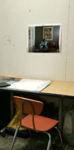 Over a drawing table in the corner of Glyneisha's studio hangs a photograph of a black man lounging on a sofa- perhaps a study for one of Glyneisha's domestic space paintings.