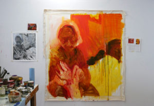 A painting-in-progress hangs side-by-side with the woodblock print test.