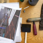 A desk full of tools in Kathy's studio space.