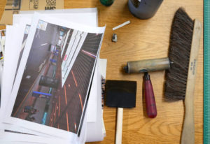 A desk full of tools in Kathy's studio space.