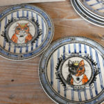 Celebration plates featuring Momoko's cats Hina and Neko.