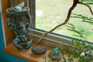 A stormy figurine on Momoko's studio windowsill.